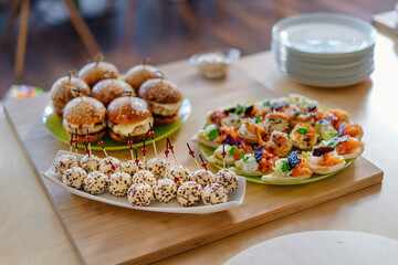 Canapes with cheese balls topped with sesame seeds. Cheese appetizer for the festive table.