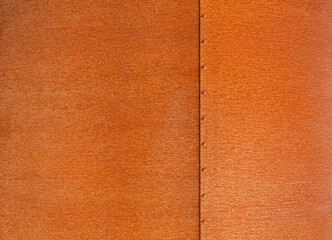 Corten steel plates background and bolts