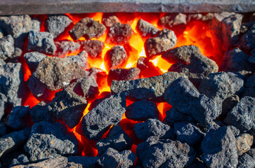 red-hot coke in a forge, closeup photo