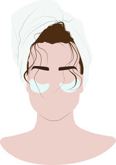 Girl with a towel on her head. Hydrogel eye patches. Cosmetic collagen eye patches against facial wrinkles. Eye patches for beauty and skin care.