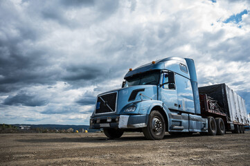 26/07/2021 Russia, Novosibirsk: A parked truck with a blue cab against a gray sky. 