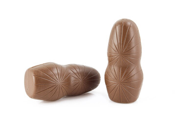 Two chocolate figures isolated on white background. Statue shaped decorative dessert