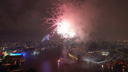Aerial drone photo of spectacular fireworks over river Thames and Greenwich area at new year's eve, London, United Kingdom