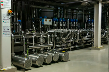 Steel pipes at beer factory - brewery equipment. Production, manufacture, industrial concept