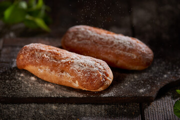 Eclairs on a dark wooden background
