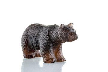 beautiful figurine of a bear made of smoky quartz on a white background