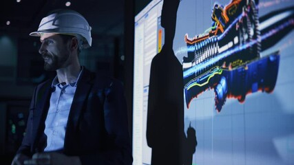 Green Energy Technology Conference Presentation: Chief Automotive Engineer Sustainable Environmental Engine Design to Investors and Businesspeople. Screen Shows 3D Model of Electirc Turbine - Powered by Adobe