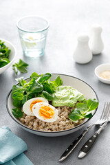 Pearl barley bowl with soft-boiled egg and corn salad