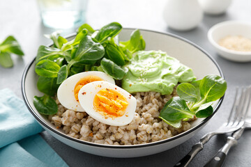 Pearl barley bowl with soft-boiled egg and corn salad