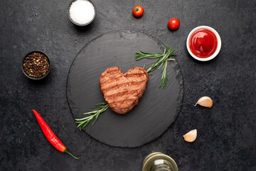 Heart shaped grilled beef steak with arrow for valentine's day on stone background