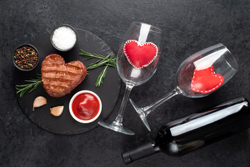 Heart shaped grilled beef steak for valentine's day on stone background