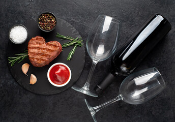 Heart shaped grilled beef steak for valentine's day on stone background