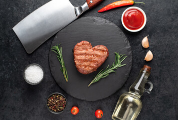 Heart shaped grilled beef steak for valentine's day on stone background