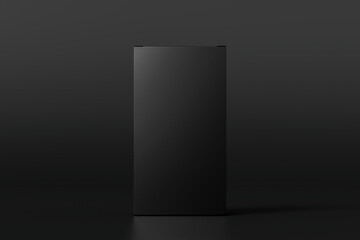 Gift box mock up: tall, flat and wide black box on black background. Front view.