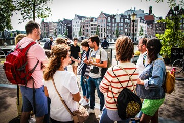 Tour Guide during a explanation in Amsterdam with a group of tourist.