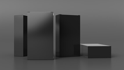 Gift box mock up: four tall, wide and flat black boxes on gray background. Front view.