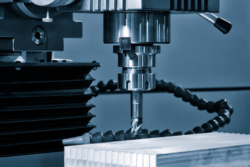 The CNC milling machine cutting the aluminium automotive part with the solid ball endmill in the...