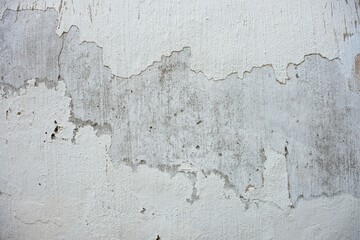 Old concrete wall with peeling paint. Grunge background