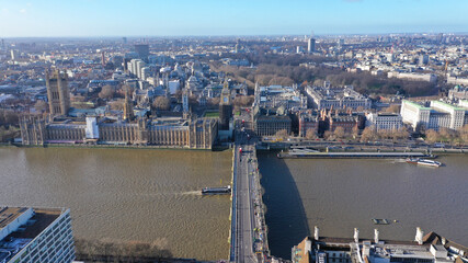 Aerial drone photo of iconic City of Westminster with houses of Parliament, Big Ben and Westminster Abbey in front of river Thames, London, United Kingdom - obrazy, fototapety, plakaty