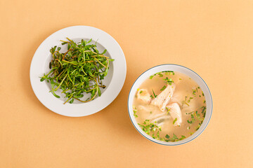 Banh canh ca loc, Thick Rice Noodles with Snakehead Fish, ietnamese food isolated on beige background, top view