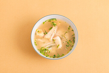 Banh canh ca loc, Thick Rice Noodles with Snakehead Fish, ietnamese food isolated on beige background, top view