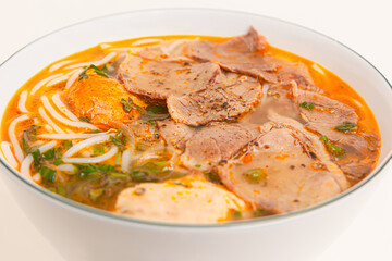 Bun Bo Hue, Vietnamese spicy beef rice noodle soup, Vietnamese food isolated on white background, closeup