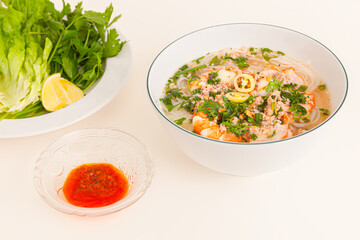 Nam Vang noodles soup, Vietnamese food isolated on white background, perspective view
