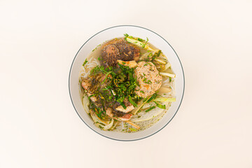Bun ca ro dong, Vietnamese rice noodles and anbas fish soup, Vietnamese food isolated on white background, top view