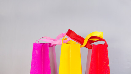 Three multi-colored packages on a gray background