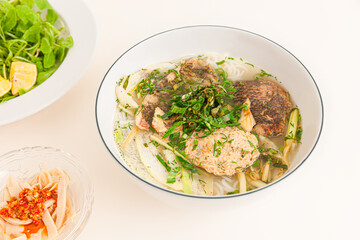 Bun ca ro dong, Vietnamese rice noodles and anbas fish soup, Vietnamese food isolated on white background, closeup