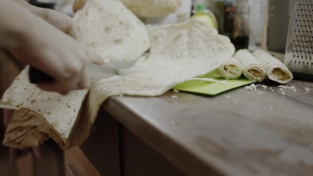chef wraps cheese in Armenian lavash, thin yeast-free bread