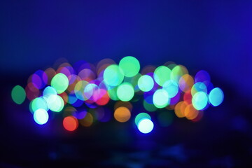 Christmas background with blurred bright lights, Garland background Christmas lights Glowing...