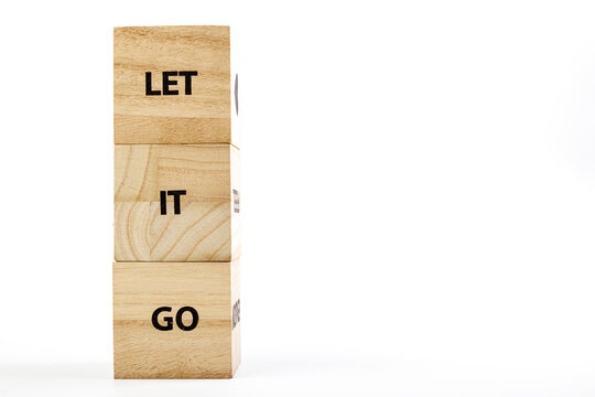 Wooden Cubes With The Inscription Let It Go On A White Background