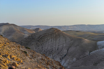 Mountain landscape, desert. Stony desert panoramic view. Unique relief geological erosion land form. Stone Desert on the West Bank. Judean Desert in clear weather. 