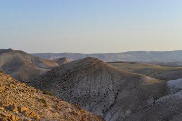 Mountain landscape, desert. Stony desert panoramic view. Unique relief geological erosion land form. Stone Desert on the West Bank. Judean Desert in clear weather. 