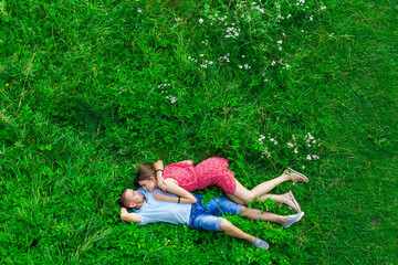 aerial view of couple in the meadow outdoors. guy and girl huggi