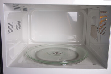 an open microwave oven. Microwave view from inside