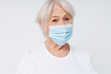 Photo of retired old lady respiratory protection isolated background