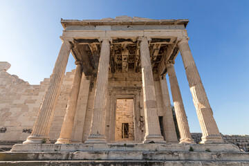 Obraz premium Athens, Greece. The Erechtheion, or Temple of Athena Polias, an ancient Greek Ionic temple-telesterion on the north side of the Acropolis