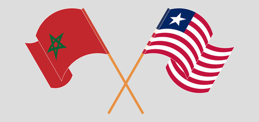 Crossed and waving flags of Morocco and Liberia
