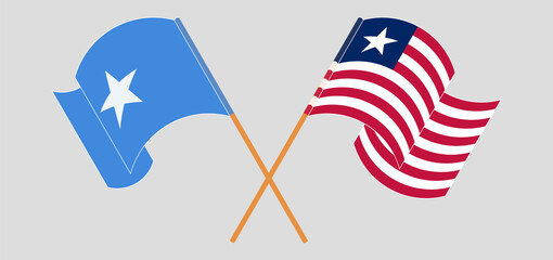 Crossed and waving flags of Somalia and Liberia