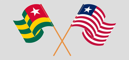 Crossed and waving flags of Togo and Liberia