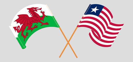 Crossed and waving flags of Wales and Liberia