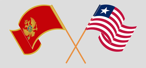 Crossed and waving flags of Montenegro and Liberia