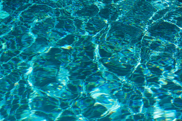 Blue ripped water in swimming pool, water pool texture and surface water backgraund.