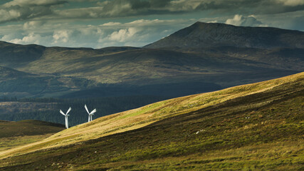 Two windmills hidden among the mountain slopes. © Jaroslaw