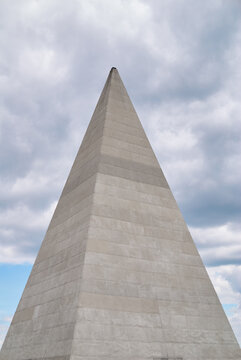 Golod Pyramid on the dramatic cloud sky background. Located near Moscow - Riga highway. Demolished by the rainy storm in 2017