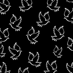 Cute vector seamless handmade patterns with white silhouettes of birds on a black background. Print in cute infantile style with flying pigeons. Flat. Vector