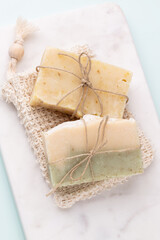 Handmade natural soap on pastel background.