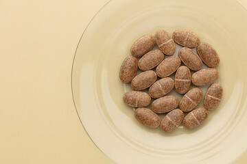 Homeopathic pill supplement. Alternative Medicine. Vitamin capsules.